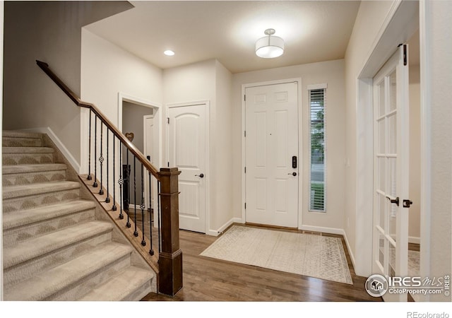6356 Twilight Ave, Firestone, CO 80504 - foyer entrance featuring wood finished floors, baseboards, stairs, and recessed lighting