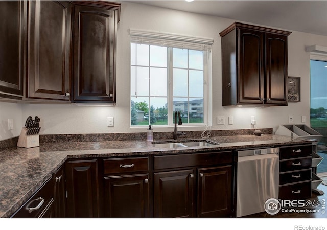 6356 Twilight Ave, Firestone, CO 80504 - kitchen featuring a sink, dishwasher, dark brown cabinetry, and dark stone countertops