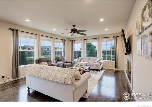 6356 Twilight Ave, Firestone, CO 80504 - living area with a ceiling fan, dark wood-style floors, recessed lighting, and baseboards