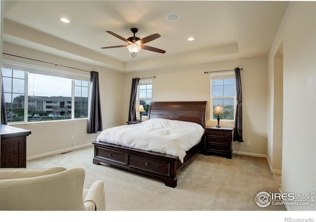 6356 Twilight Ave, Firestone, CO 80504 - bedroom with a tray ceiling, light carpet, baseboards, and recessed lighting