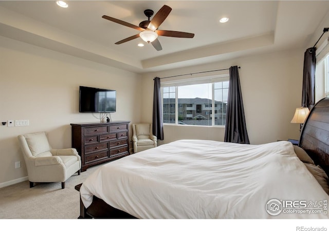 6356 Twilight Ave, Firestone, CO 80504 - carpeted bedroom featuring a raised ceiling, recessed lighting, a ceiling fan, and baseboards