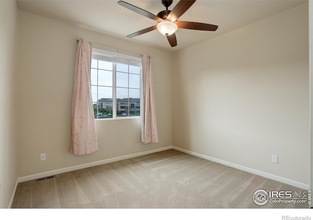 6356 Twilight Ave, Firestone, CO 80504 - spare room featuring light colored carpet, a ceiling fan, and baseboards