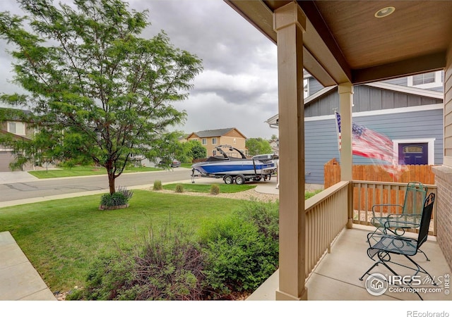 6356 Twilight Ave, Firestone, CO 80504 - covered porch featuring a lawn