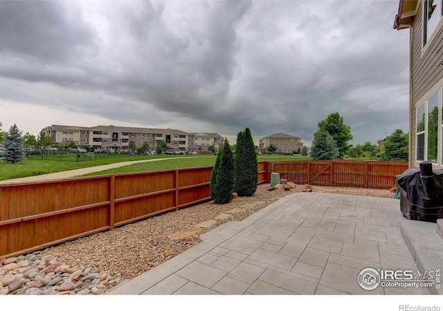 6356 Twilight Ave, Firestone, CO 80504 - fenced backyard with a patio, a residential view, and grilling area