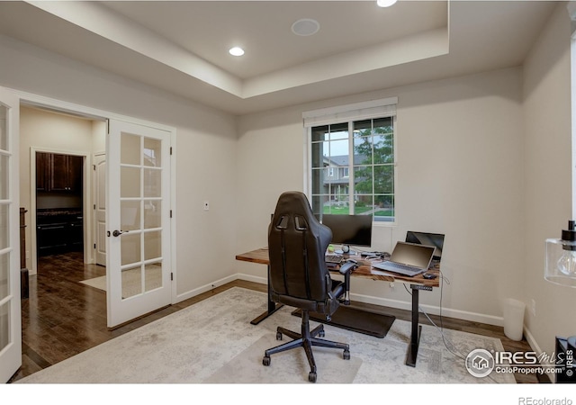 6356 Twilight Ave, Firestone, CO 80504 - office featuring french doors, baseboards, wood finished floors, a raised ceiling, and recessed lighting