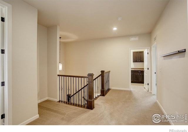 6356 Twilight Ave, Firestone, CO 80504 - corridor featuring an upstairs landing, carpet floors, baseboards, and recessed lighting