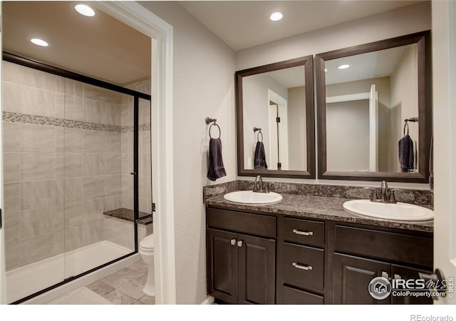 6356 Twilight Ave, Firestone, CO 80504 - full bath with toilet, a shower stall, double vanity, and recessed lighting
