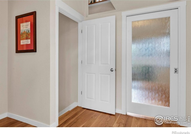 13255 Red Deer Trl, Broomfield, CO 80020 - corridor with wood finished floors and baseboards