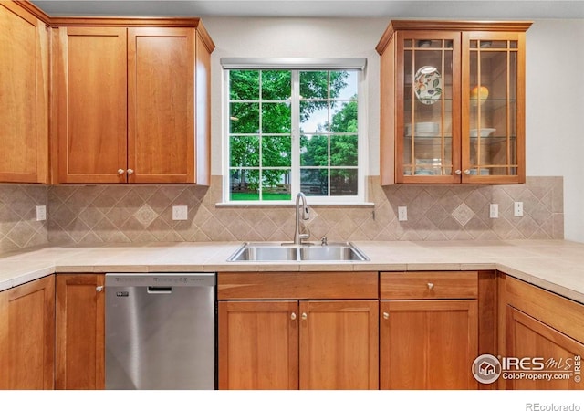 13255 Red Deer Trl, Broomfield, CO 80020 - kitchen with stainless steel dishwasher, a sink, glass insert cabinets, backsplash, and light countertops