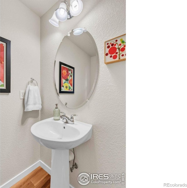 13255 Red Deer Trl, Broomfield, CO 80020 - bathroom featuring wood finished floors and baseboards