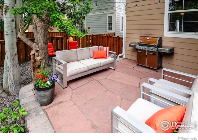 13255 Red Deer Trl, Broomfield, CO 80020 - view of patio / terrace featuring an outdoor living space and area for grilling