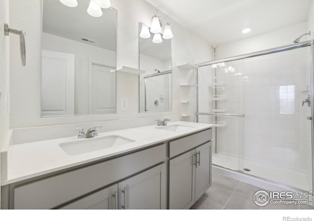1800 Vantage Pkwy, Berthoud, CO 80513 - bathroom with a shower stall, double vanity, and tile patterned flooring