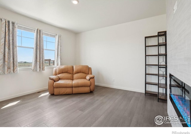 1800 Vantage Pkwy, Berthoud, CO 80513 - sitting room with wood finished floors, baseboards, recessed lighting, and a fireplace