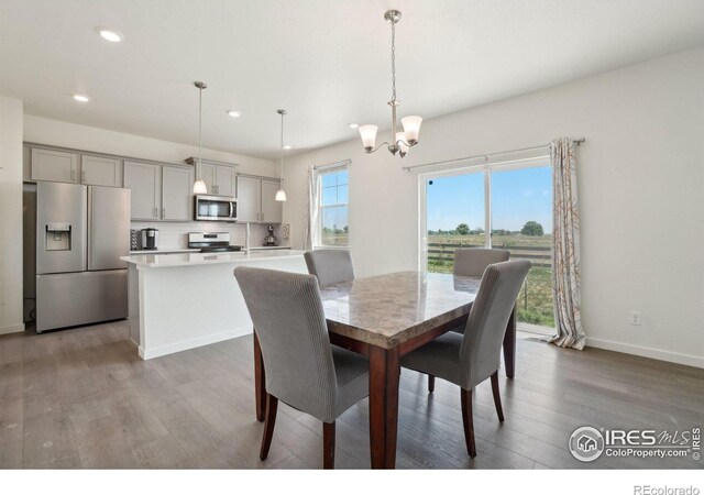 1800 Vantage Pkwy, Berthoud, CO 80513 - dining space with a chandelier, light wood-type flooring, recessed lighting, and baseboards