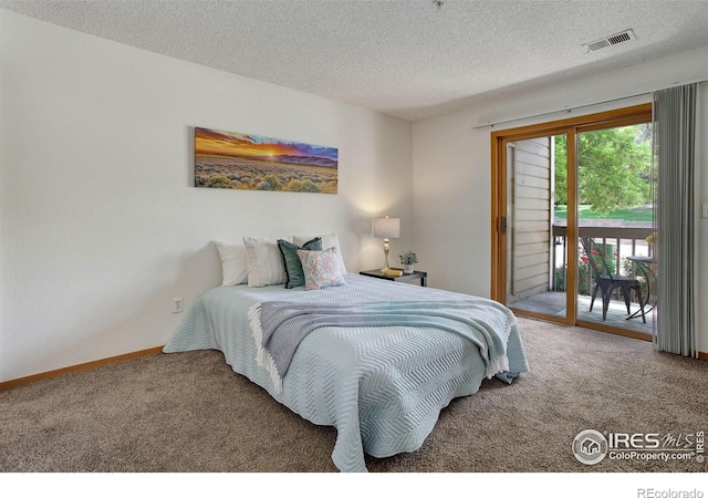 2800 Sundown Ln Unit 109, Boulder, CO 80303 - bedroom with carpet, access to outside, a textured ceiling, and baseboards