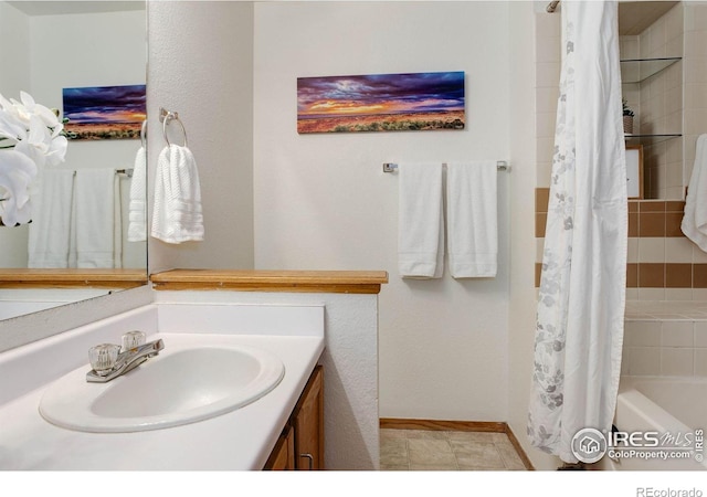 2800 Sundown Ln Unit 109, Boulder, CO 80303 - bathroom with vanity, shower / bath combination with curtain, and baseboards