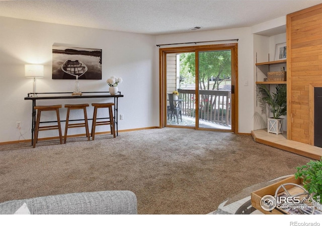 2800 Sundown Ln Unit 109, Boulder, CO 80303 - doorway featuring carpet floors, a textured ceiling, and baseboards