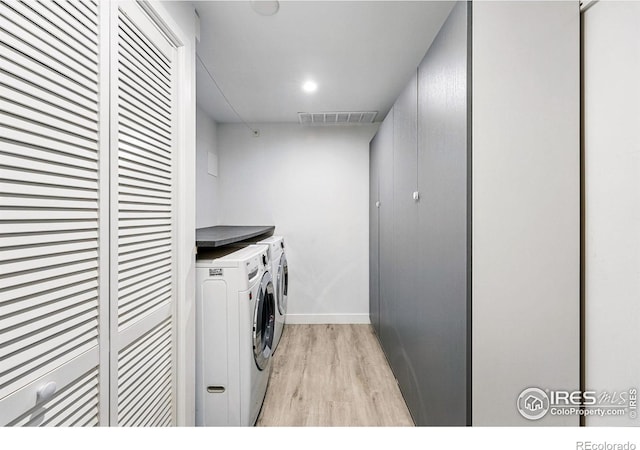 1350 Lehigh St, Boulder, CO 80305 - washroom with washer and clothes dryer, light wood finished floors, and baseboards