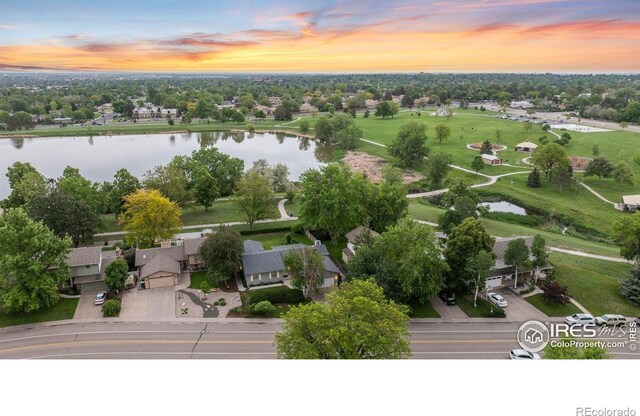 1400 38th Ave, Greeley, CO 80634 - aerial view at dusk of a water view, a residential view, and view of scattered trees