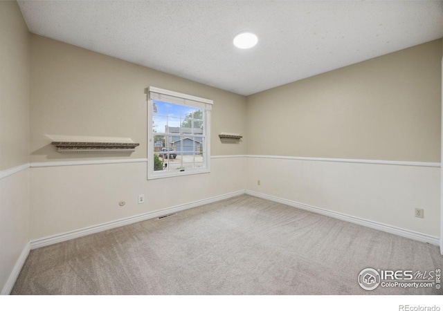 1400 38th Ave, Greeley, CO 80634 - carpeted empty room featuring baseboards
