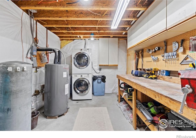 251 Huron Rd, Red Feather Lakes, CO 80545 - unfinished below grade area with stacked washer / dryer, a workshop area, and electric water heater