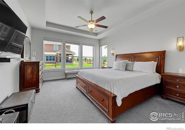 1954 Raindrop Dr, Windsor, CO 80550 - bedroom featuring carpet, a tray ceiling, ceiling fan, and baseboards