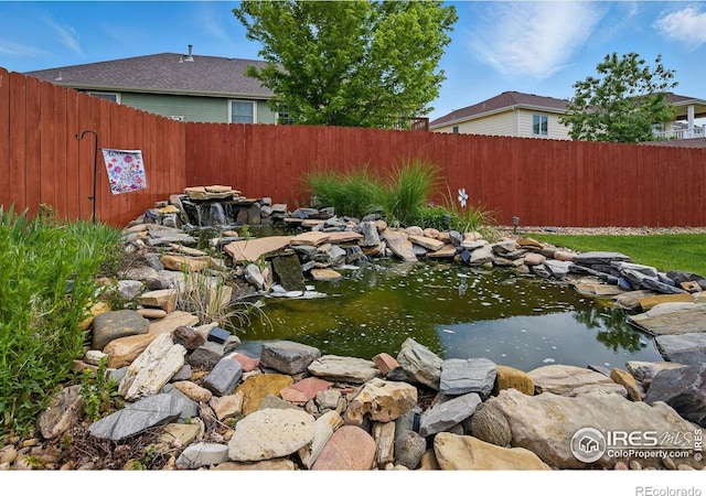 3006 54th Ave, Greeley, CO 80634 - view of yard featuring a garden pond