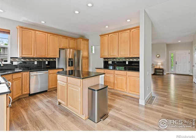 14675 Golden Eagle Run, Broomfield, CO 80023 - kitchen with appliances with stainless steel finishes, plenty of natural light, backsplash, and recessed lighting