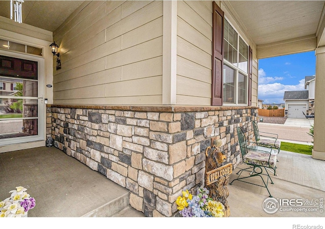 926 Birchdale Ct, Windsor, CO 80550 - doorway to property with a porch and stone siding
