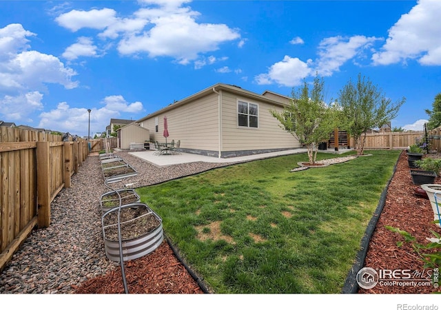 926 Birchdale Ct, Windsor, CO 80550 - view of yard featuring a vegetable garden and a patio