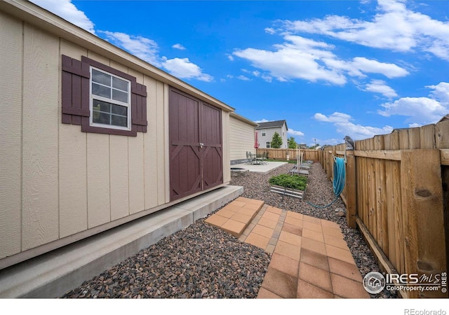 926 Birchdale Ct, Windsor, CO 80550 - view of side of property with a fenced backyard and a patio area