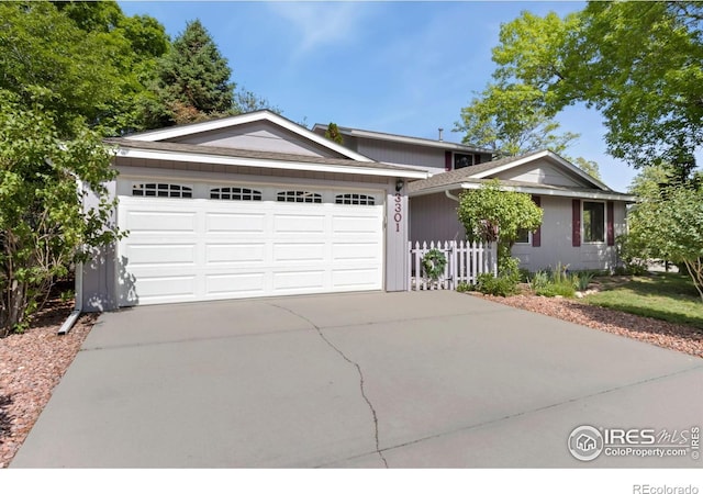 3301 Downing Ct, Fort Collins, CO 80526 - ranch-style home featuring concrete driveway and a garage