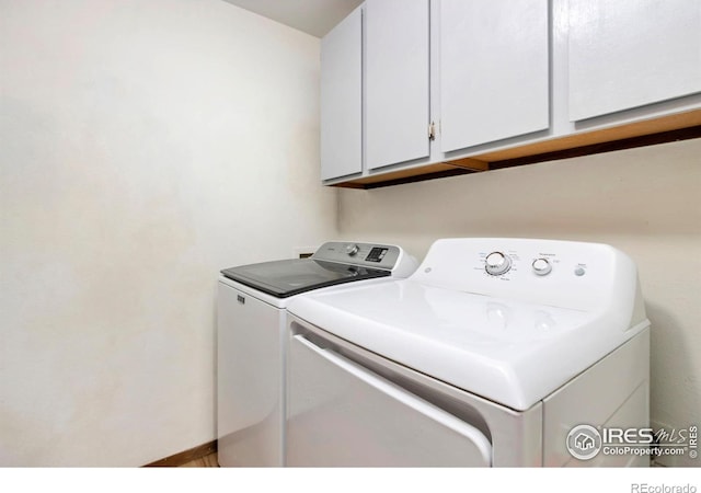 3301 Downing Ct, Fort Collins, CO 80526 - laundry area with washing machine and clothes dryer and cabinet space
