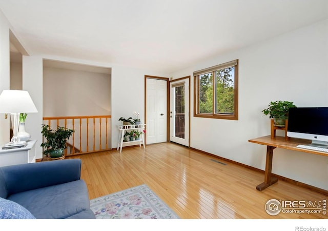 3301 Downing Ct, Fort Collins, CO 80526 - living room with hardwood / wood-style flooring and baseboards