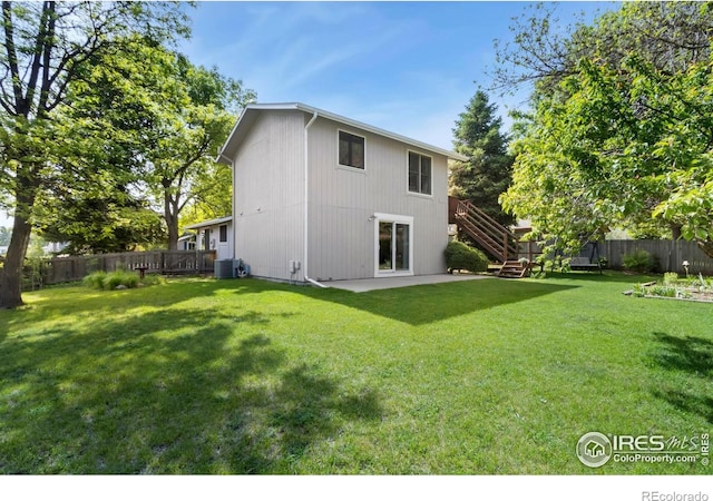 3301 Downing Ct, Fort Collins, CO 80526 - rear view of house with stairs, a patio area, and central AC unit