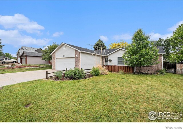209 N 44th Avenue Ct, Greeley, CO 80634 - view of front of property featuring brick siding, a garage, and concrete driveway