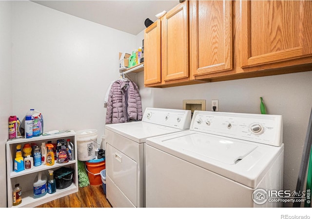 209 N 44th Avenue Ct, Greeley, CO 80634 - laundry room featuring separate washer and dryer, dark wood-style flooring, and cabinet space