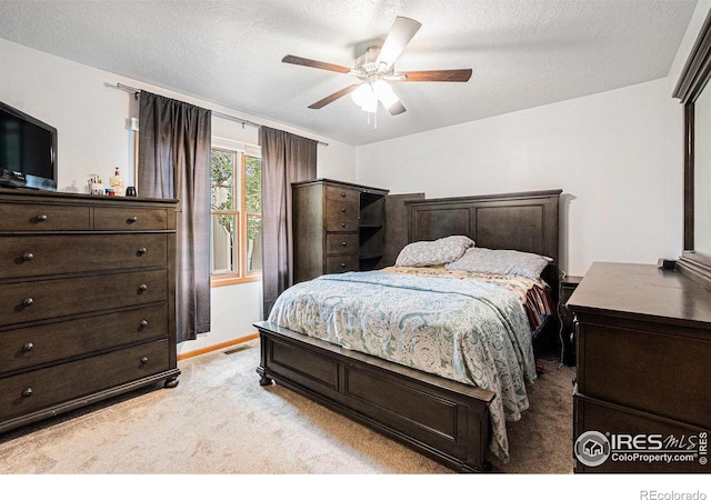 209 N 44th Avenue Ct, Greeley, CO 80634 - bedroom featuring light colored carpet, ceiling fan, baseboards, and a textured ceiling