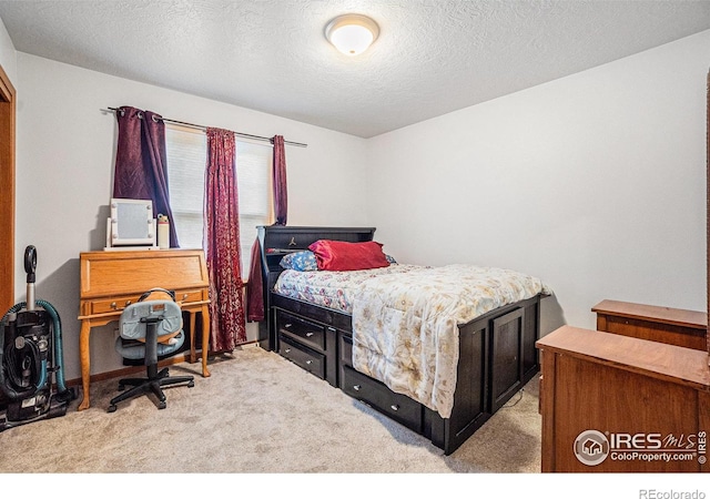 209 N 44th Avenue Ct, Greeley, CO 80634 - carpeted bedroom with a textured ceiling