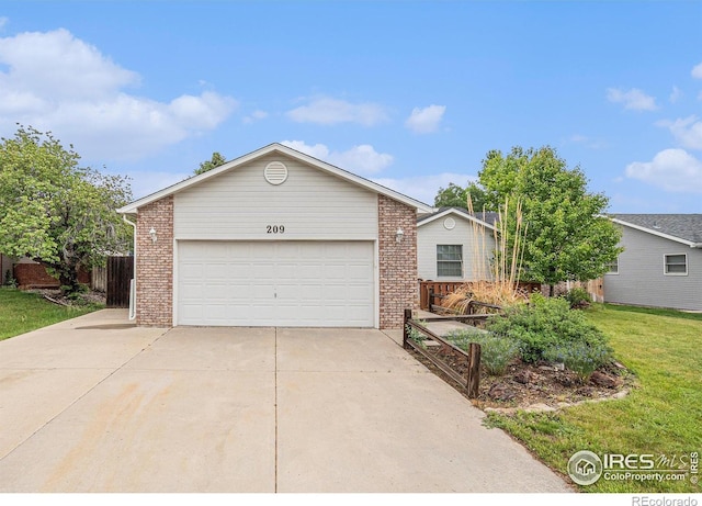 209 N 44th Avenue Ct, Greeley, CO 80634 - ranch-style home featuring brick siding, driveway, and a garden