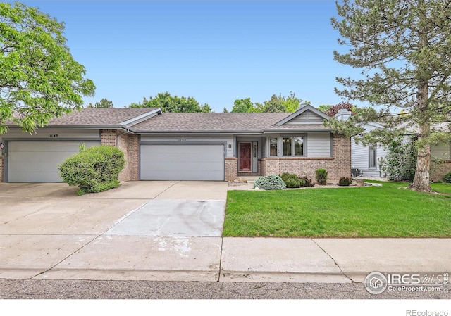 1154 Spanish Oak Ct, Fort Collins, CO 80525 - ranch-style home with brick siding, an attached garage, driveway, a front yard, and a chimney