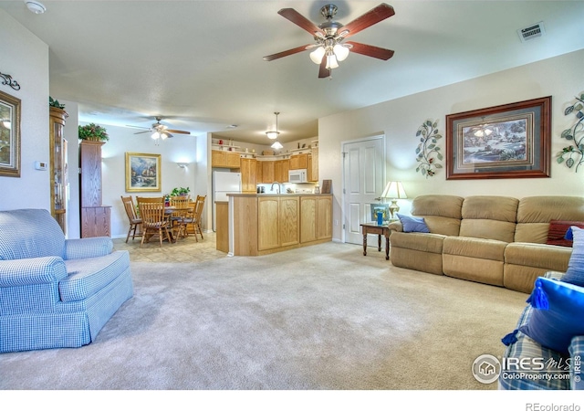 10818 Cimarron St Unit 1203, Firestone, CO 80504 - living room with ceiling fan and light colored carpet
