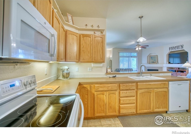 10818 Cimarron St Unit 1203, Firestone, CO 80504 - kitchen with white appliances, a sink, a peninsula, ceiling fan, and light countertops