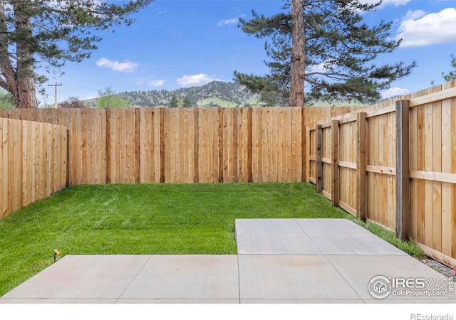 3335 Broadway St, Boulder, CO 80304 - view of yard featuring a patio and a mountain view