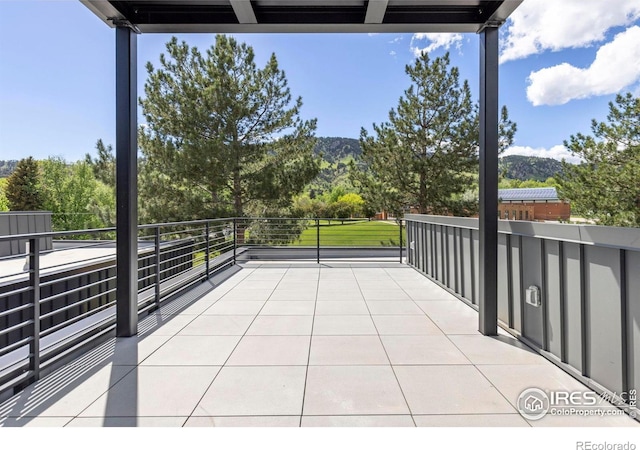 3335 Broadway St, Boulder, CO 80304 - view of patio with a balcony and a mountain view