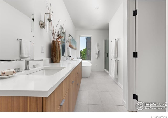 3335 Broadway St, Boulder, CO 80304 - bathroom featuring a freestanding bath, double vanity, a shower stall, tile patterned floors, and baseboards