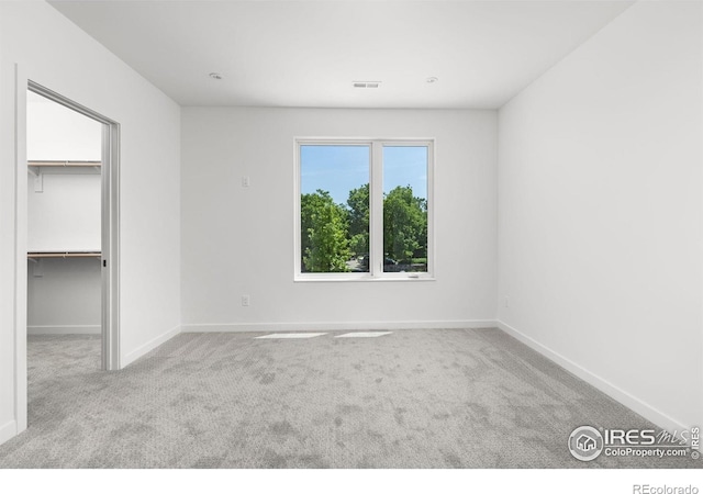 3335 Broadway St, Boulder, CO 80304 - unfurnished bedroom featuring carpet flooring, baseboards, a walk in closet, and a closet