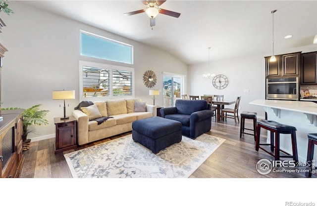 1384 Copeland Falls Rd, Severance, CO 80550 - living area featuring vaulted ceiling, a ceiling fan, wood finished floors, a chandelier, and recessed lighting