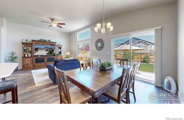 1384 Copeland Falls Rd, Severance, CO 80550 - dining area featuring a ceiling fan, a chandelier, and wood finished floors