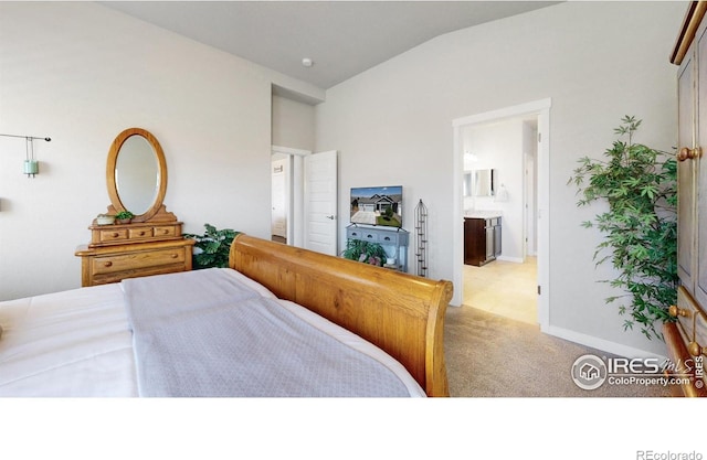 1384 Copeland Falls Rd, Severance, CO 80550 - bedroom with lofted ceiling, carpet flooring, baseboards, and ensuite bath